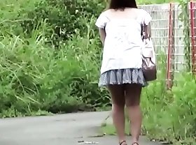 Unconventional asian teen peeing